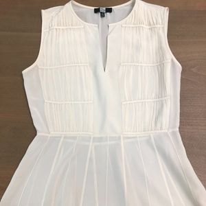 Cream peplum Saks Fifth Avenue silk blouse, size 4